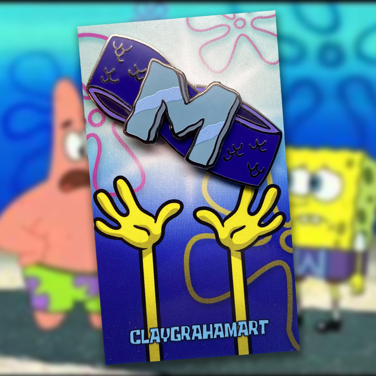 Set to Wumbo 2&amp;quot; Hard Enamel Pin w/ spinning &amp;quot;M&amp;quot;