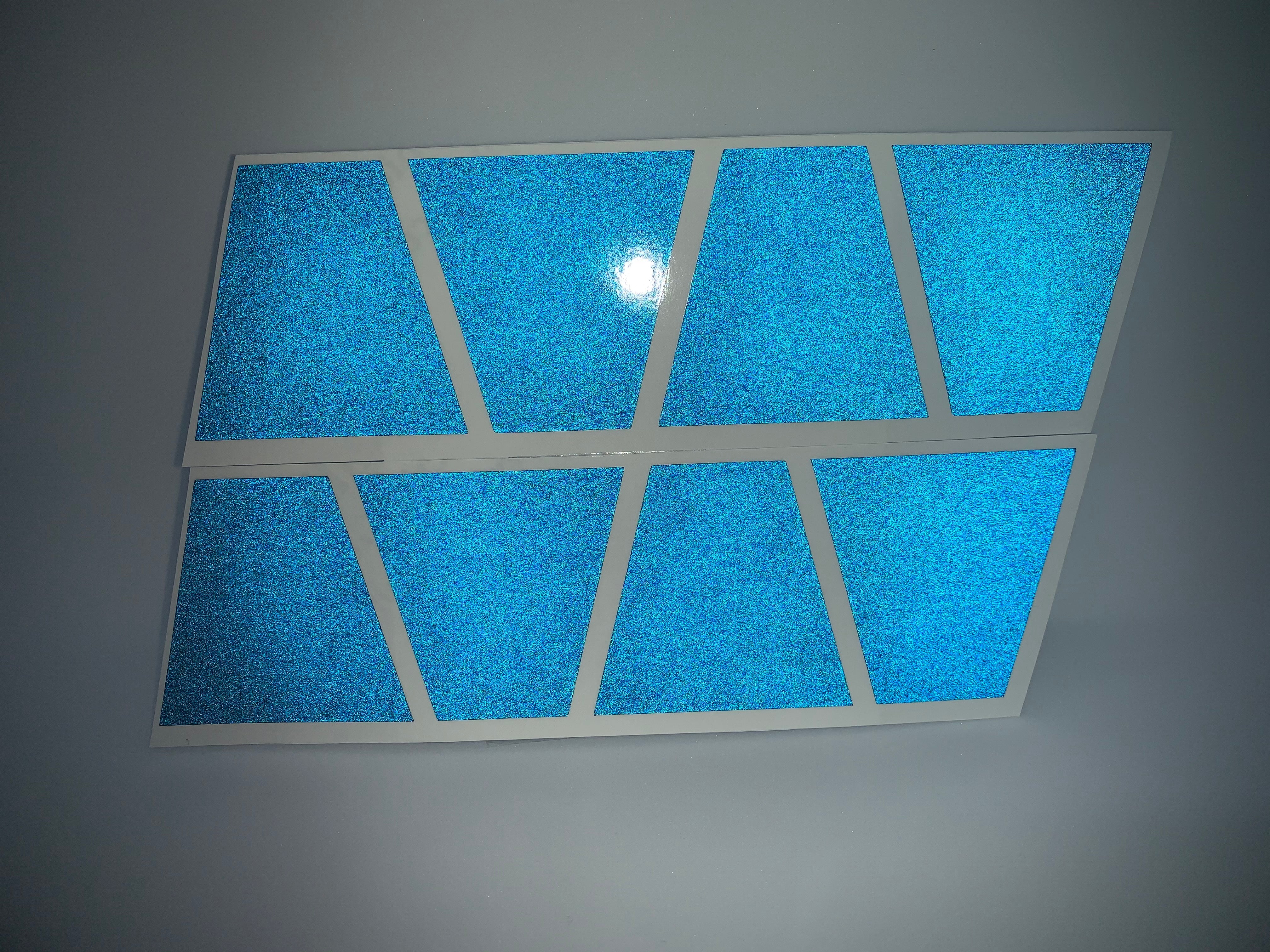 BLACKED OUT BLUE REFLECTIVE HELMET (TET) TETRAHEDRON 8 PACK