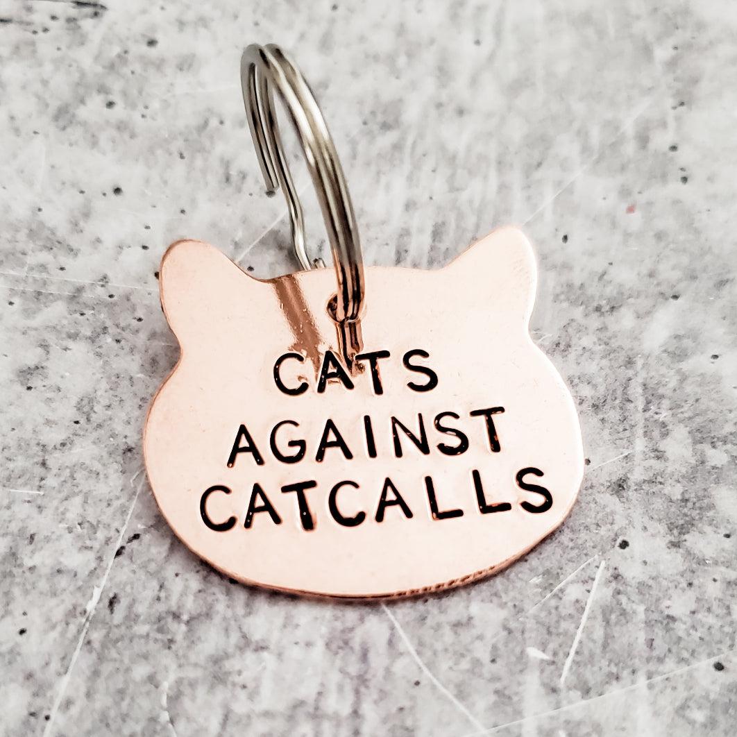 CATS AGAINST CATCALLS COPPER CAT KEYCHAIN