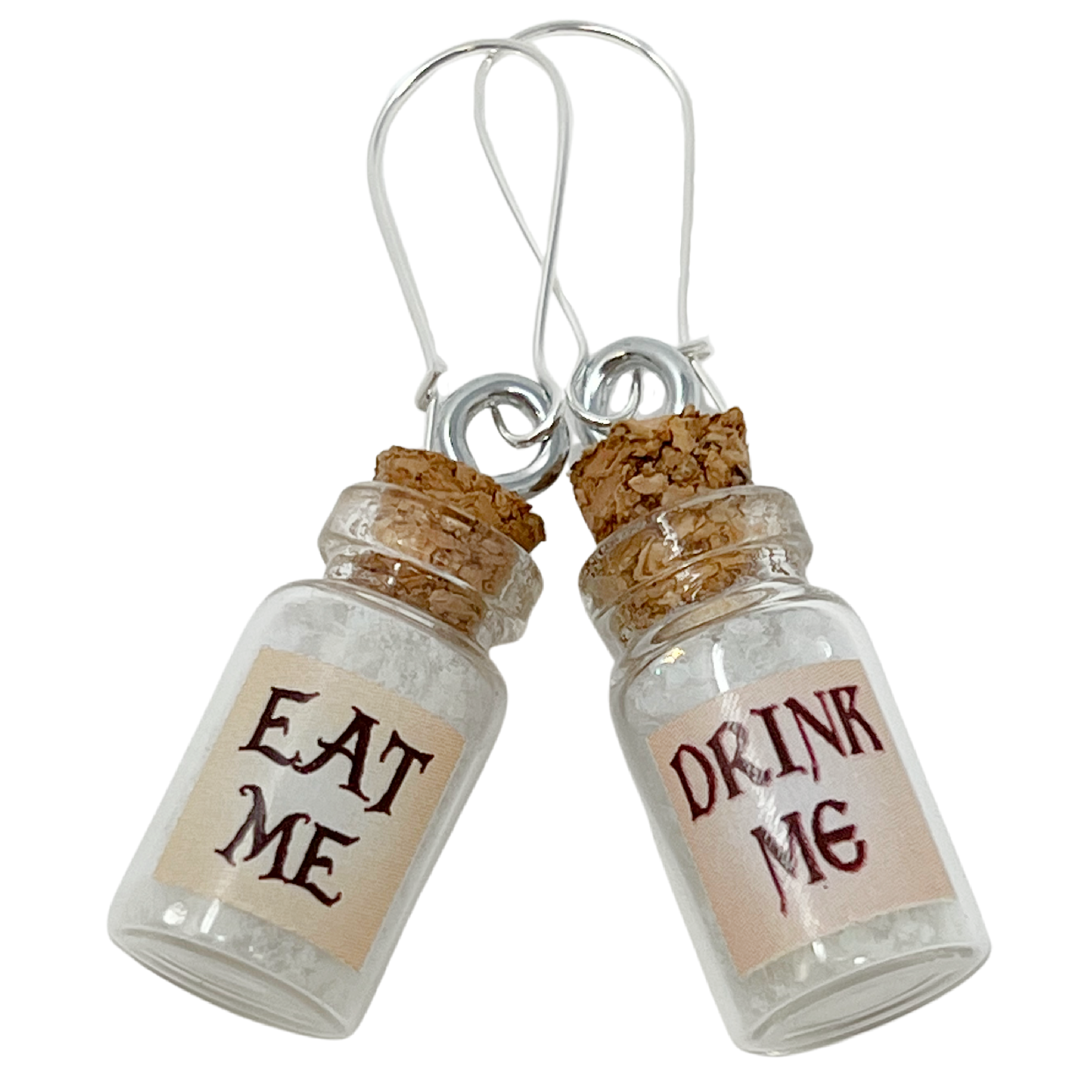 Mismatched earrings Eat Drink me glow in the dark