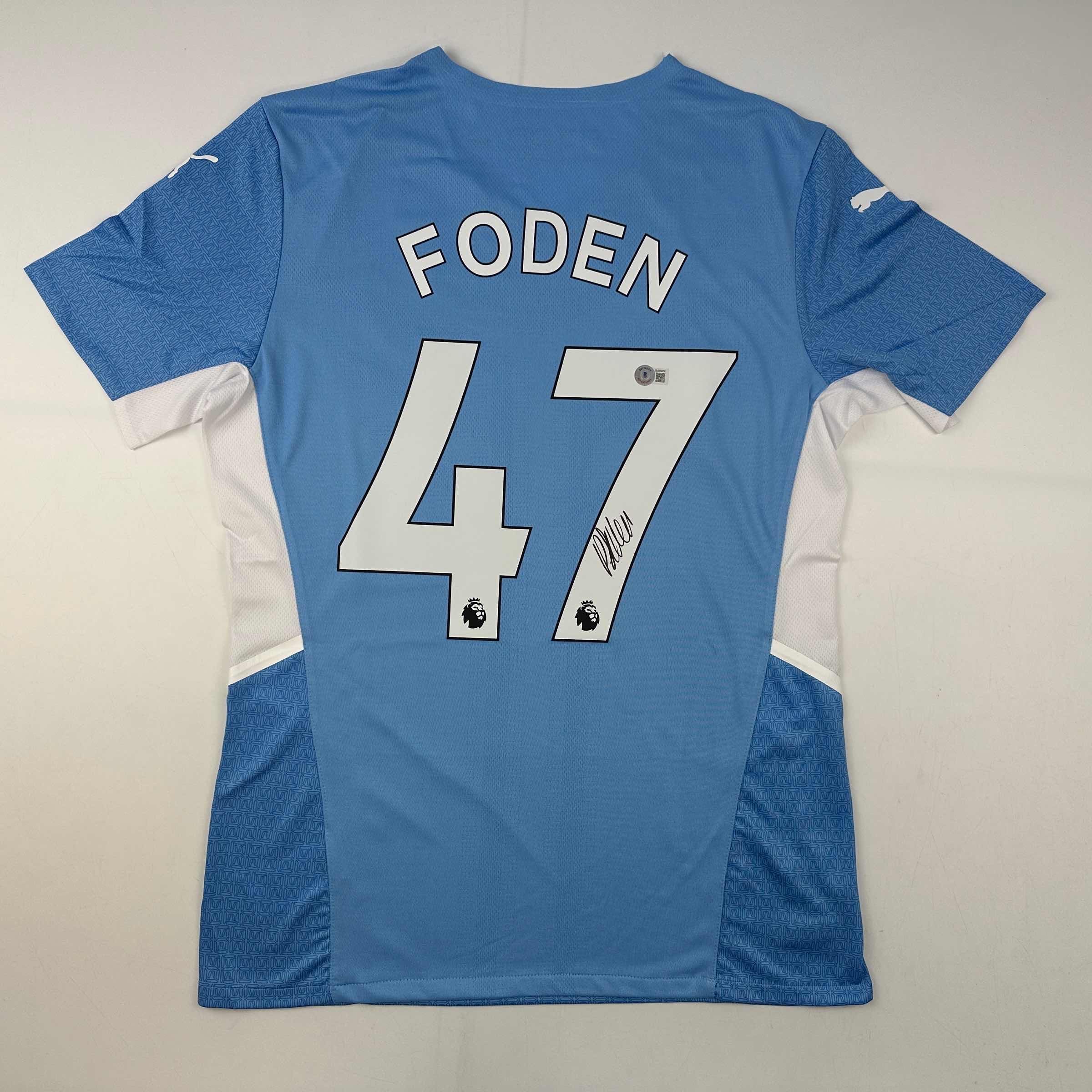 Autographed/Signed Phil Foden Manchester City Blue Soccer Futbol Jersey Beckett BAS COA