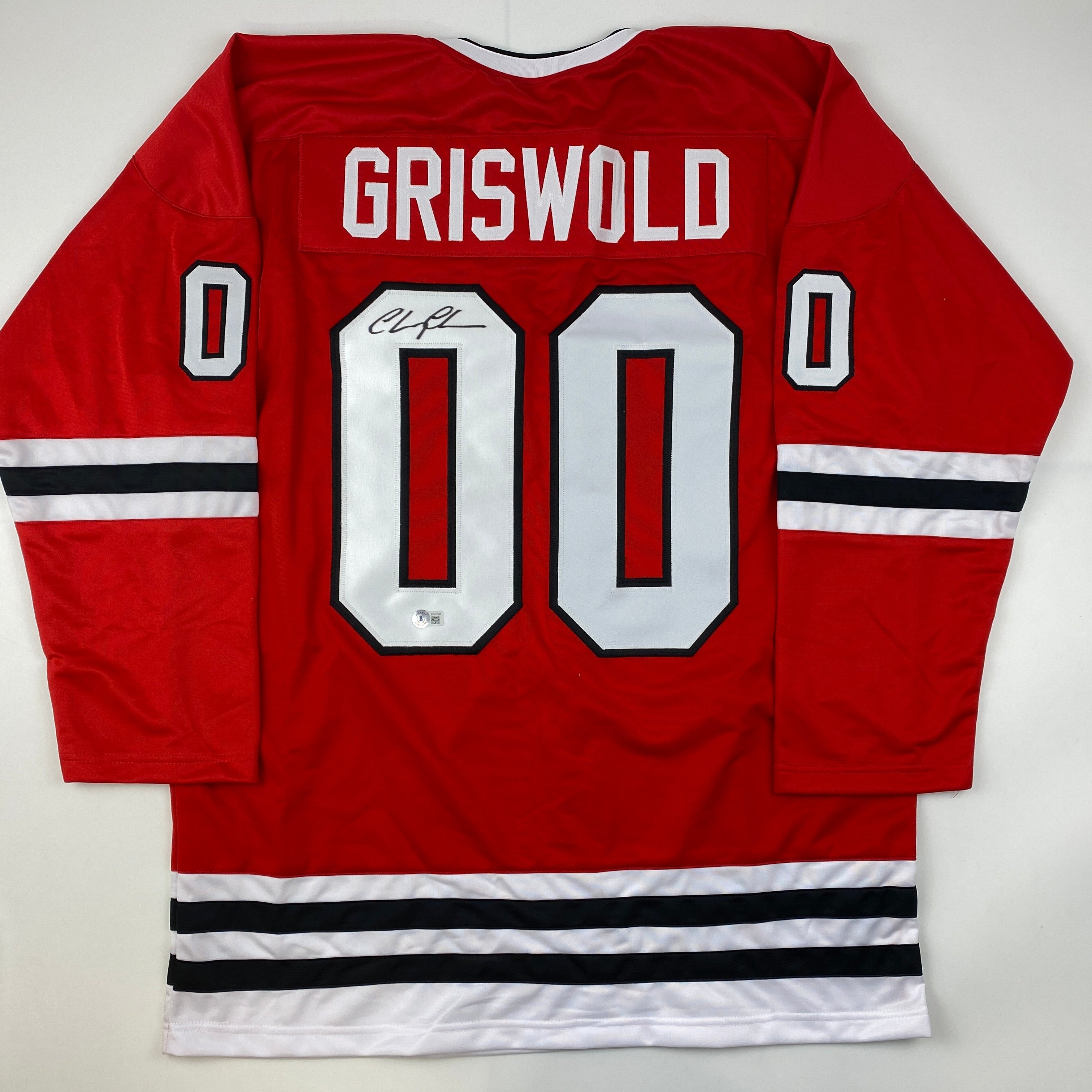Autographed/Signed Chevy Chase Clark Griswold Christmas Vacation Movie Chicago Red Hockey Jersey Beckett BAS COA