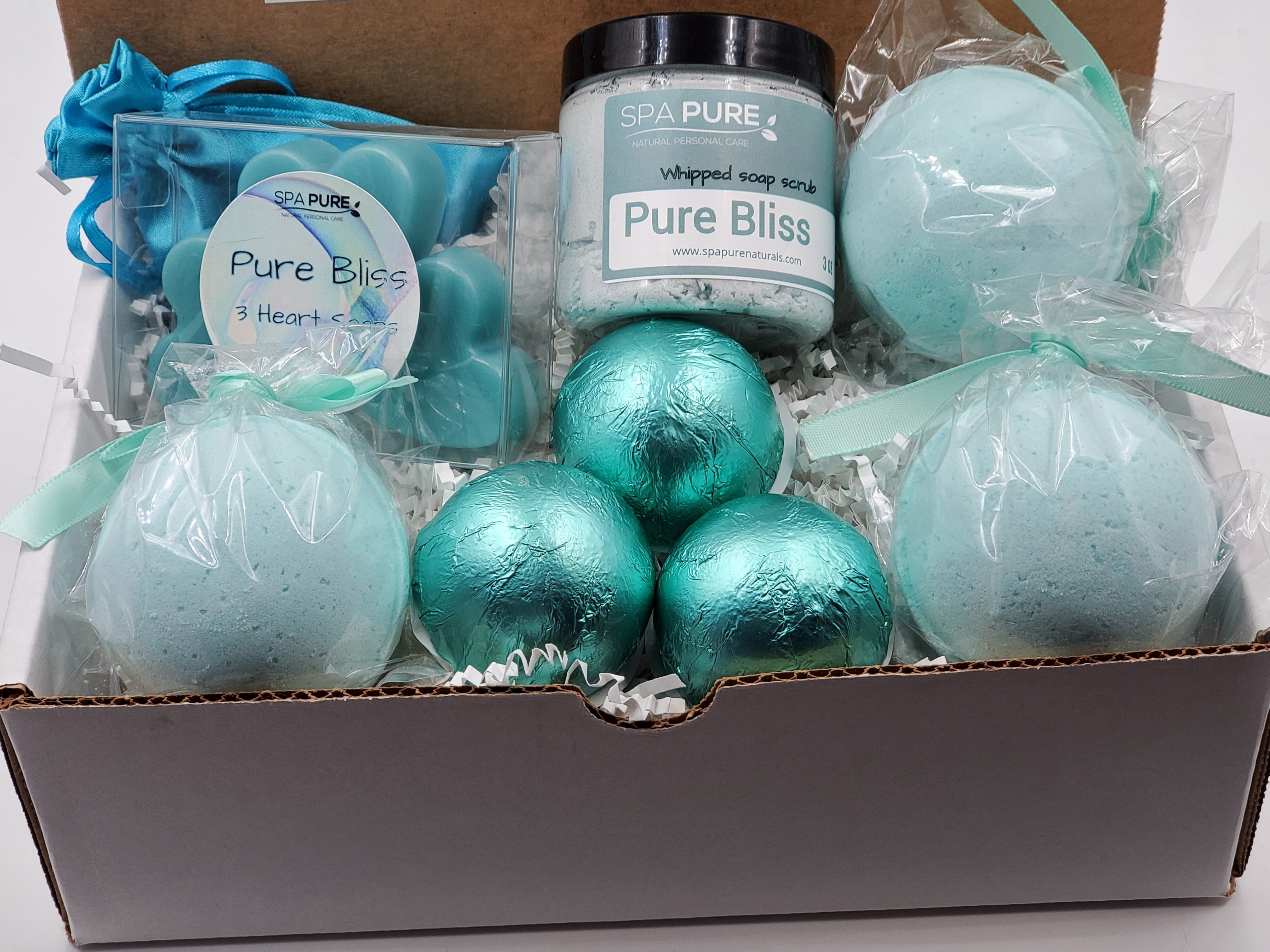 Spa Pure Luxury Spa Kit - Pure Bliss - 3 XL Pure Bliss Bath Fizzies, 3 Pure Bliss shower steamers, 3 Heart-shaped soaps, one 3.5 oz Pure Bliss whipped soap scrub, 1 Roll-on Perfume, Perfect for a mini-spa treatment.