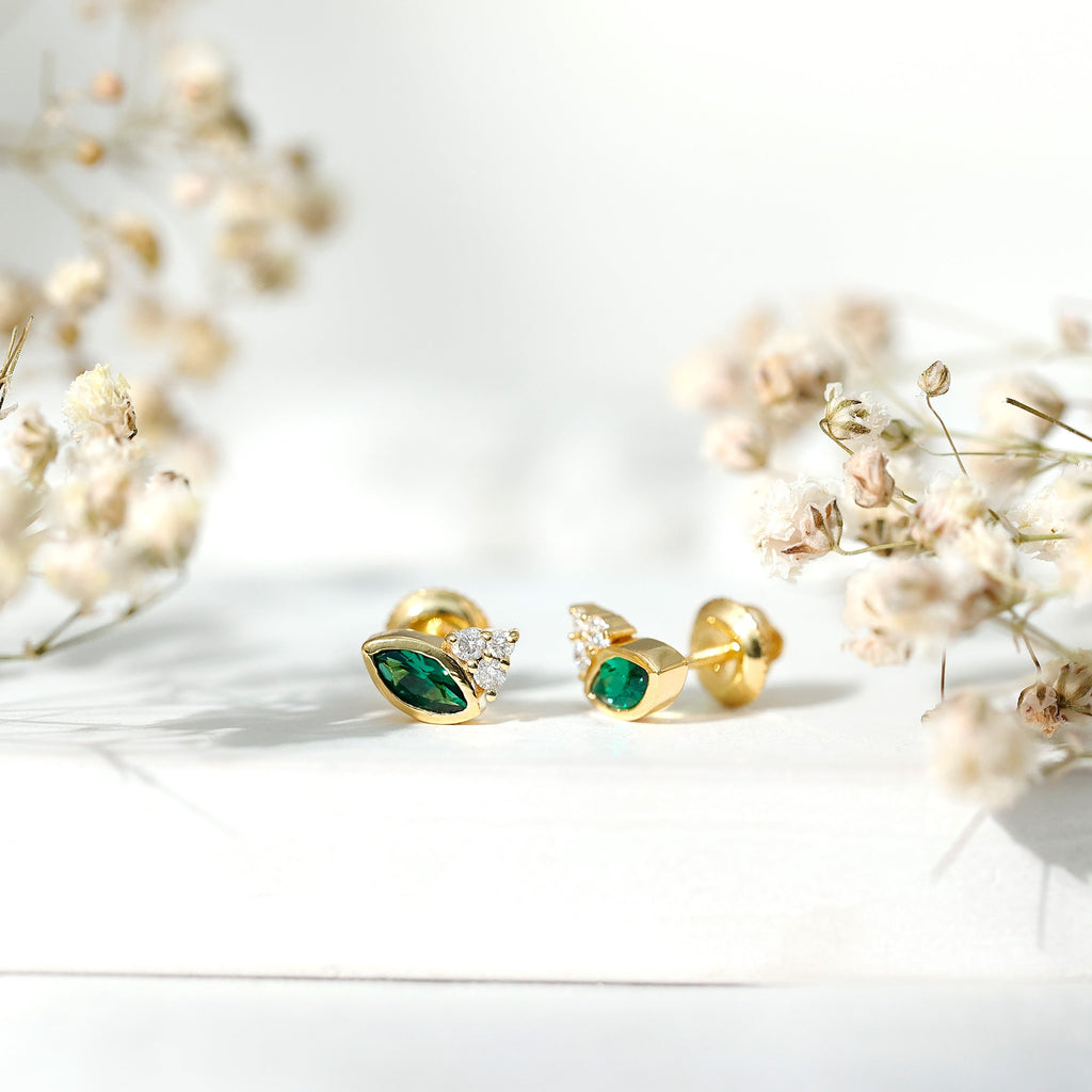 Marquise Cut Lab Grown Emerald Stud Earrings with Diamond Trio