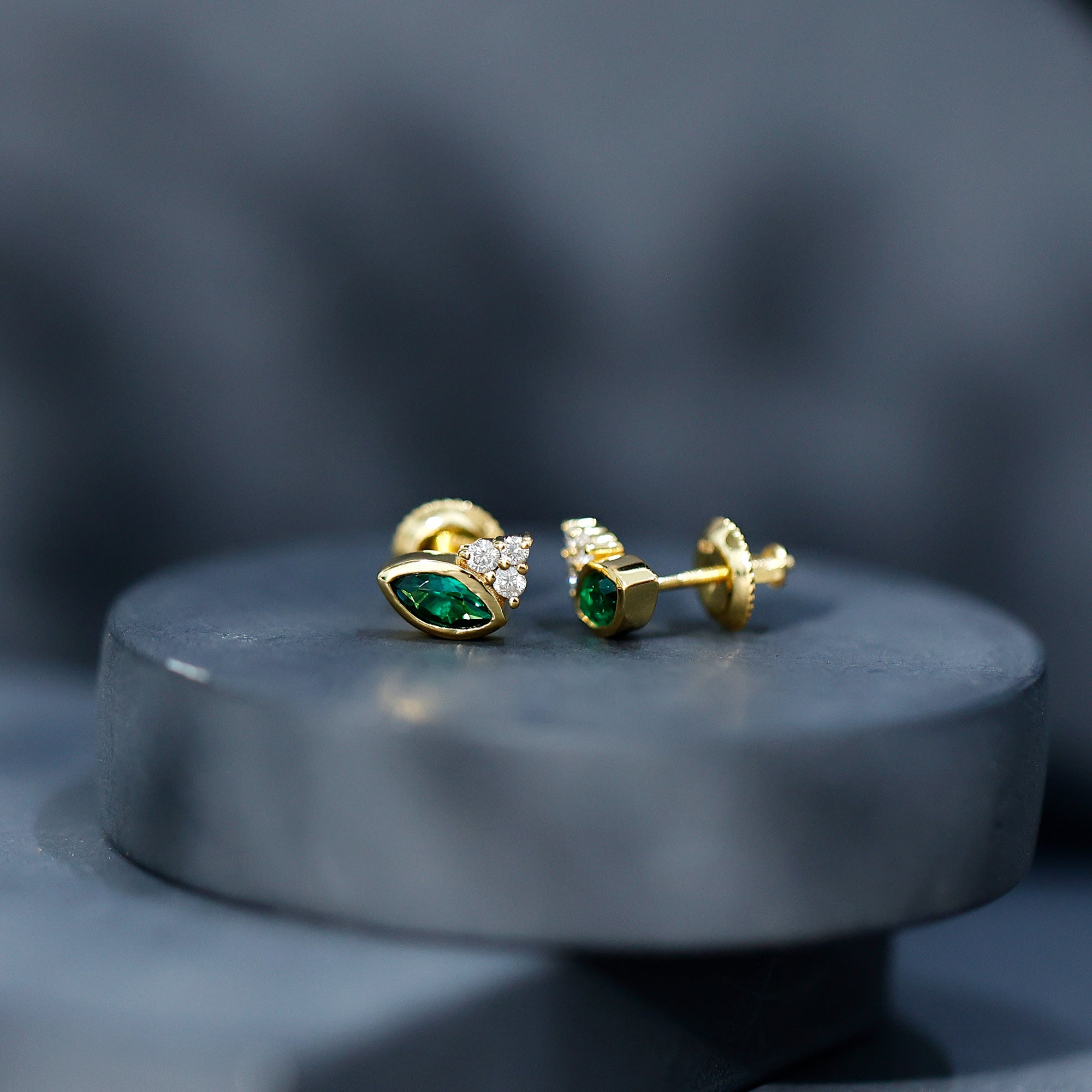Marquise Cut Lab Grown Emerald Stud Earrings with Diamond Trio