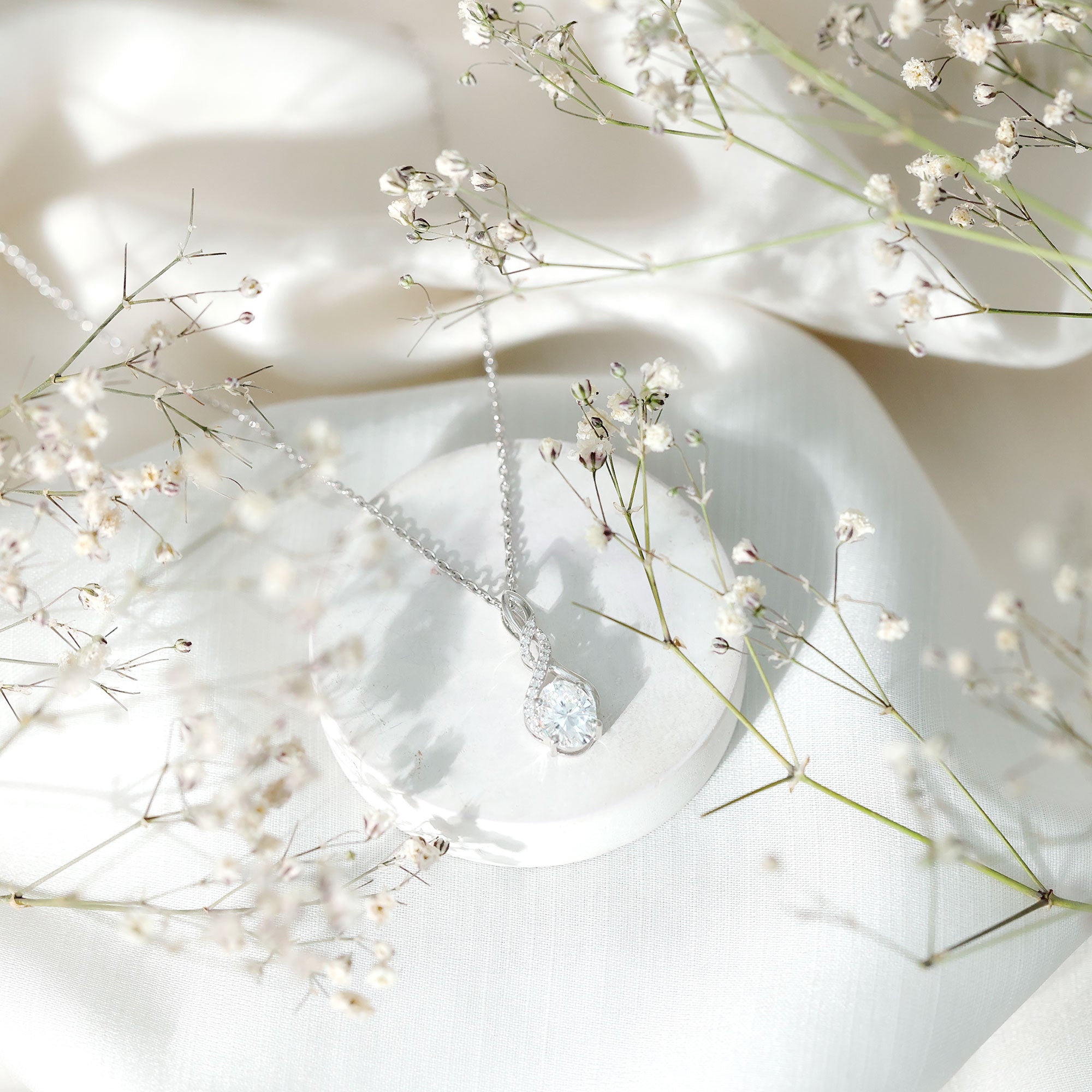 Moissanite Infinity Pendant Necklace in Sterling Silver