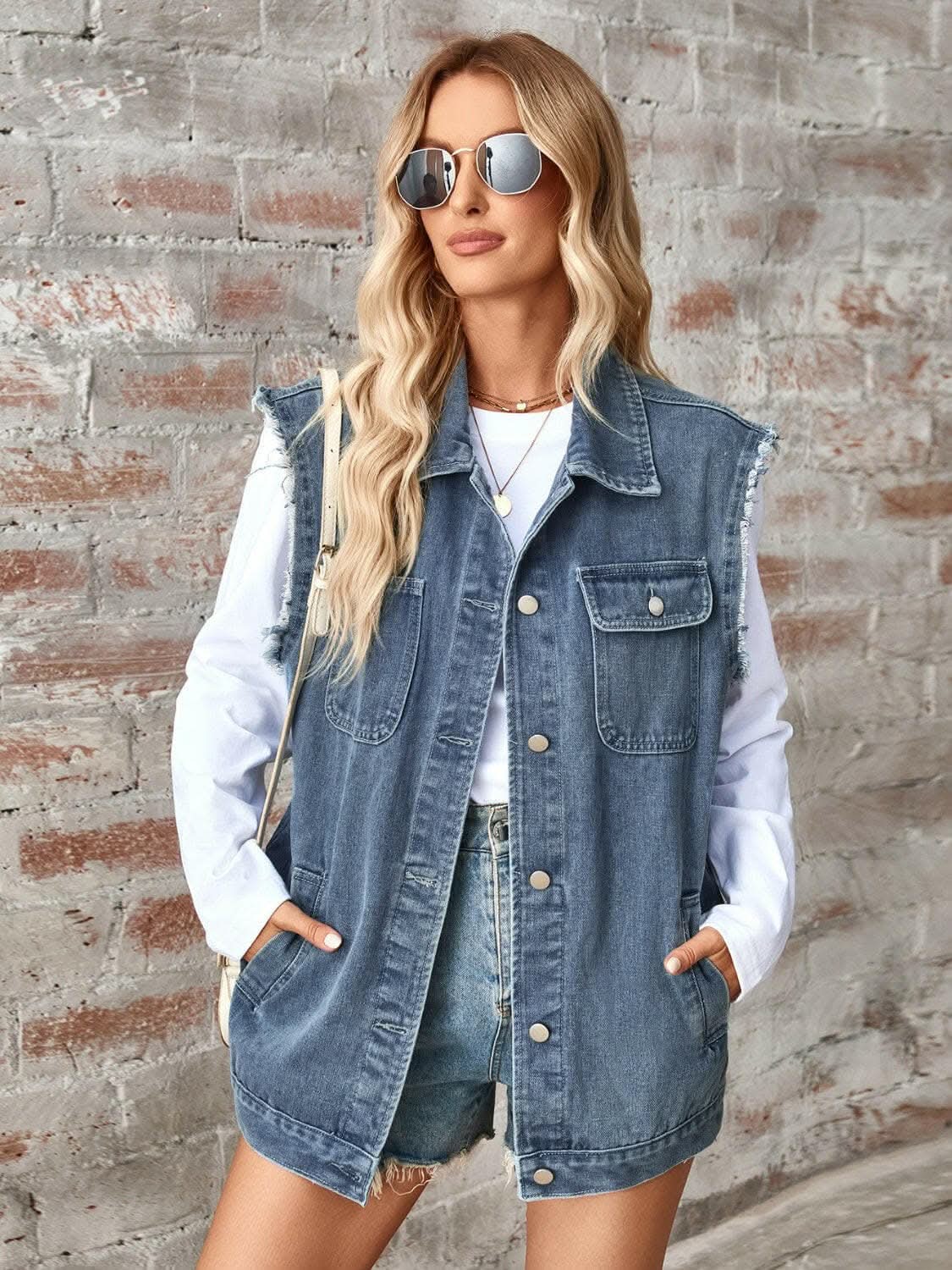 Sleeveless denim jacket with raw hem