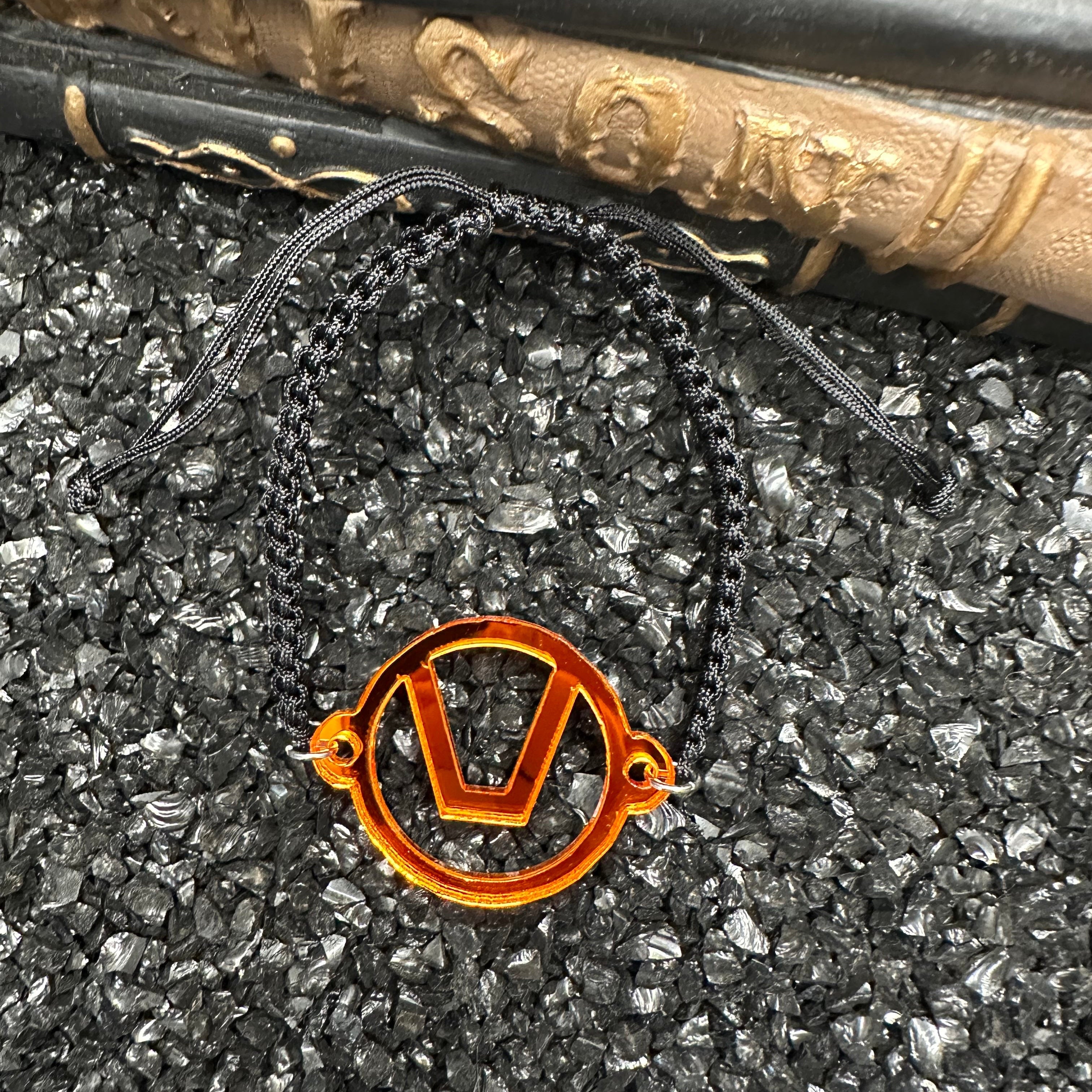 Swinger Symbol Orange Acrylic Bracelet on Adjustable Black Cord