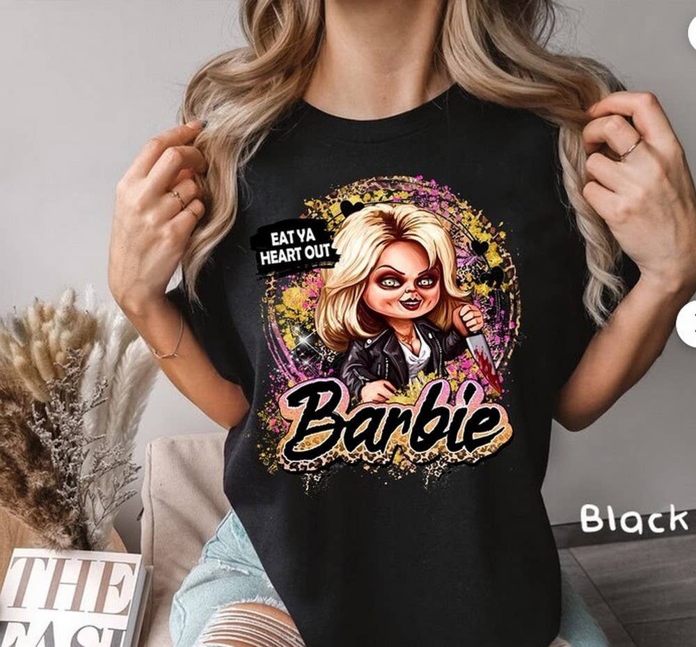 Tiffany “Eat Ya Heart Out Barbie” Tee – Halloween Horror Graphic Shirt
