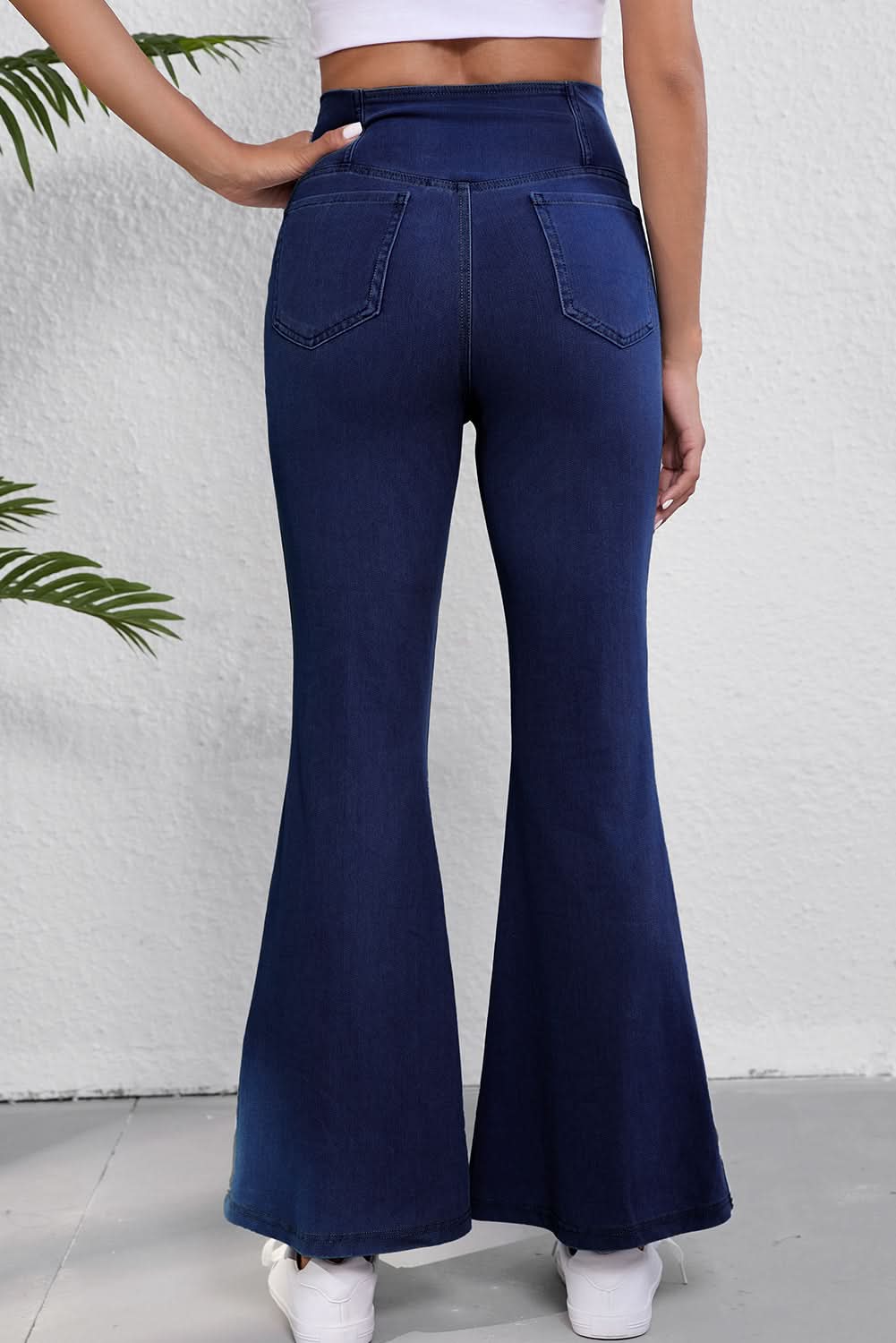 Dusk blue flare jeans with crossed waist