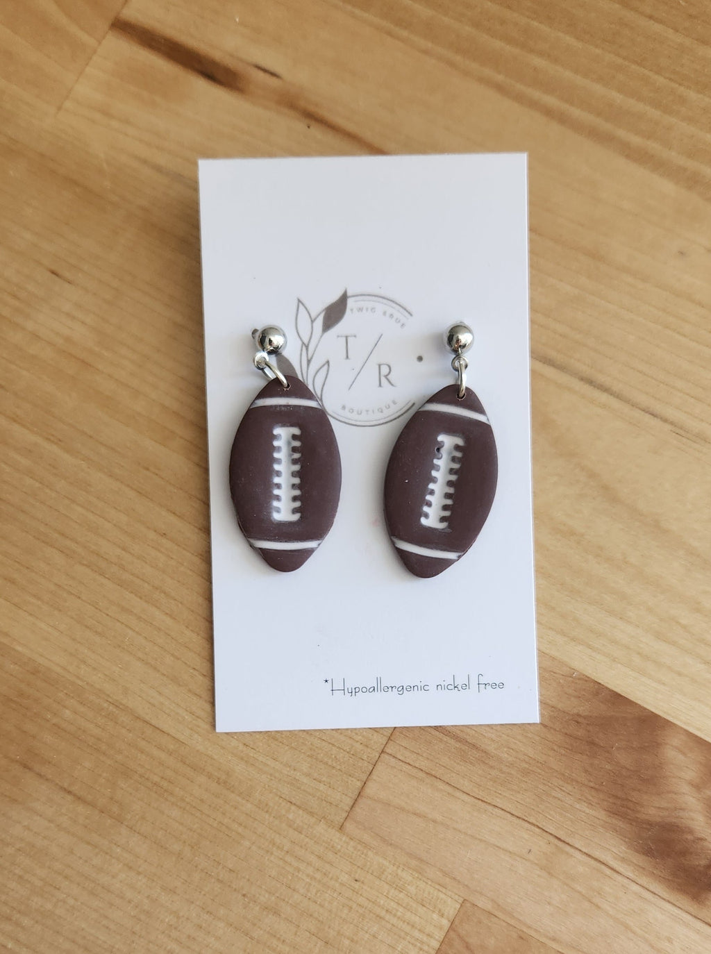 Football dangle earrings